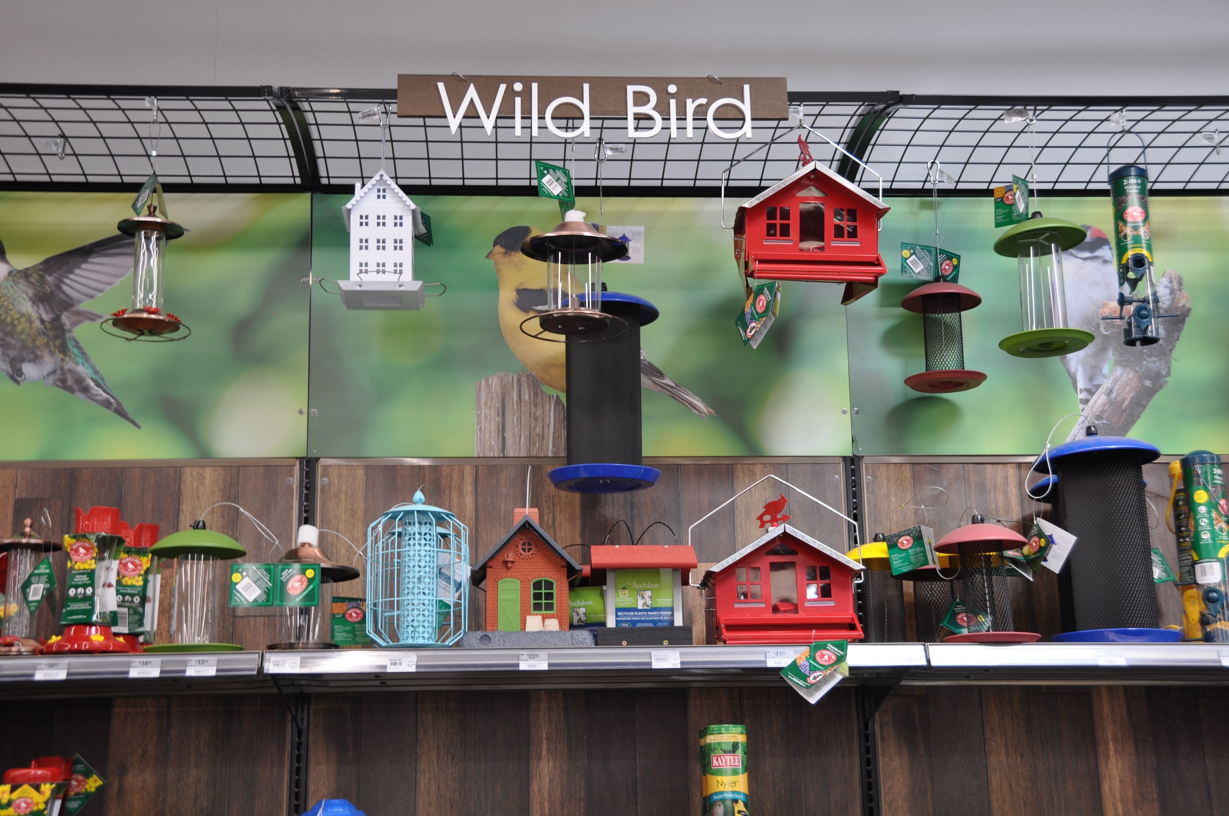 A photo displaying a sample of different bird feeders and houses available at Ace Hardware.