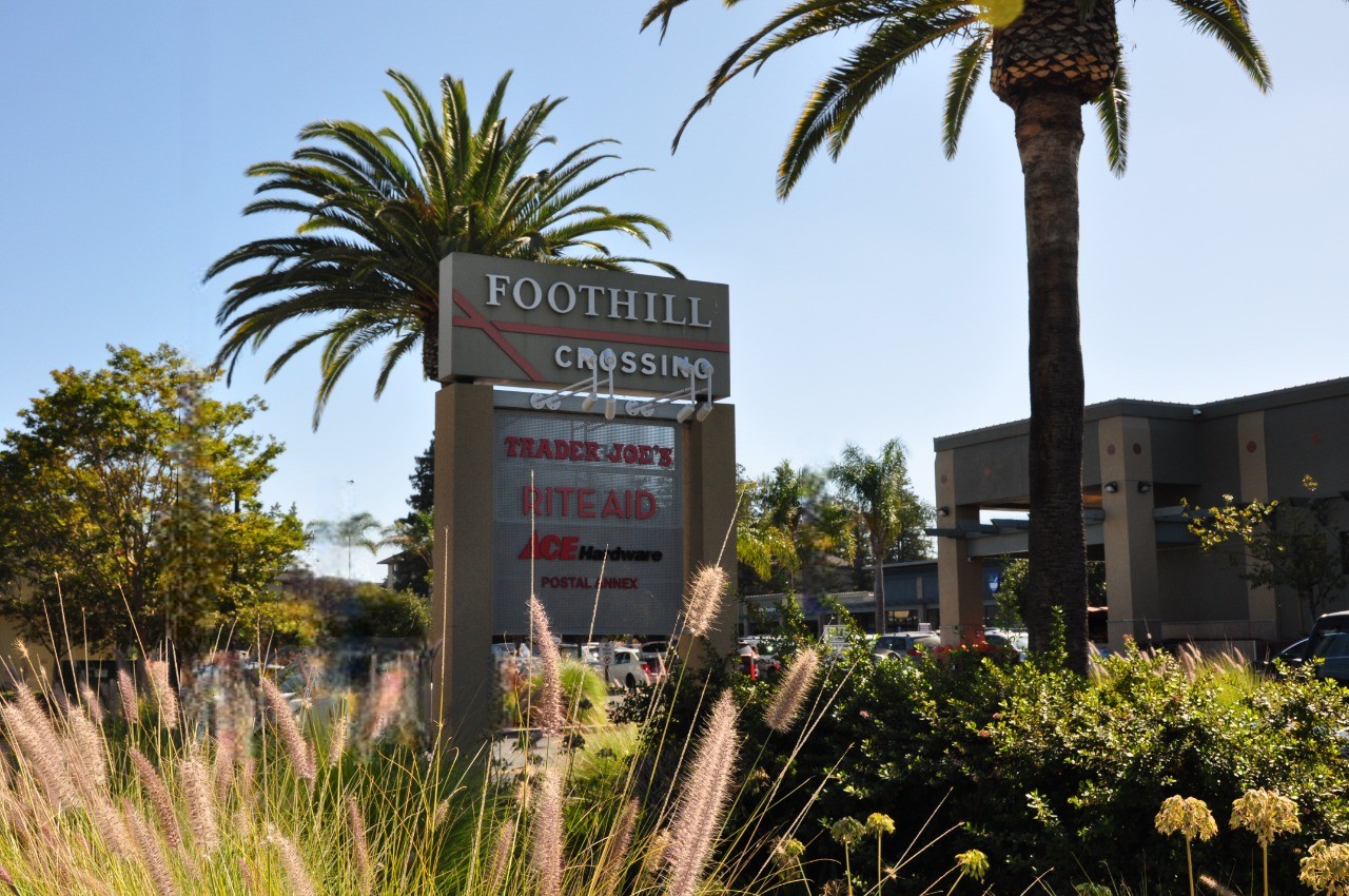 Foothill Crossing Shopping Center monument sign. Tenants listed include Trader Joe's, Rite Aid, Ace Hardware and Postal Annex.